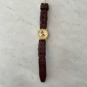 Mickey Mouse watch, genuine leather band. In good condition. Needs new battery.